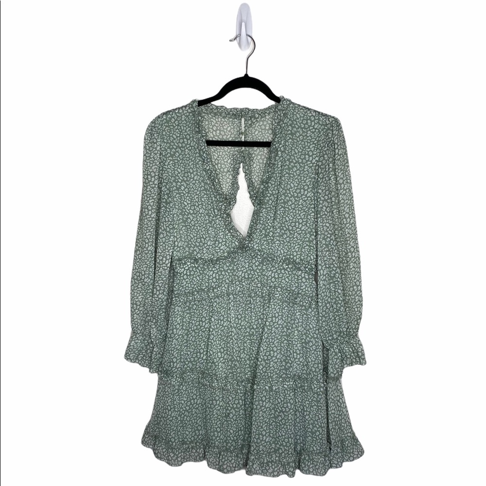 Green deep V neck, ruffle, mini dress. Boho vibes